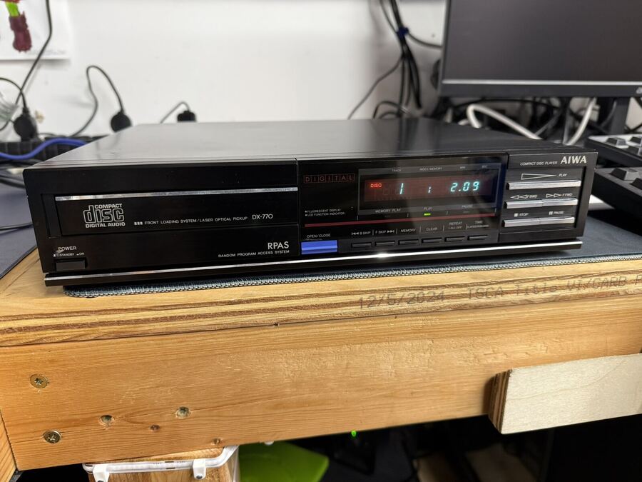 Black mid-80s CD player with its display lit