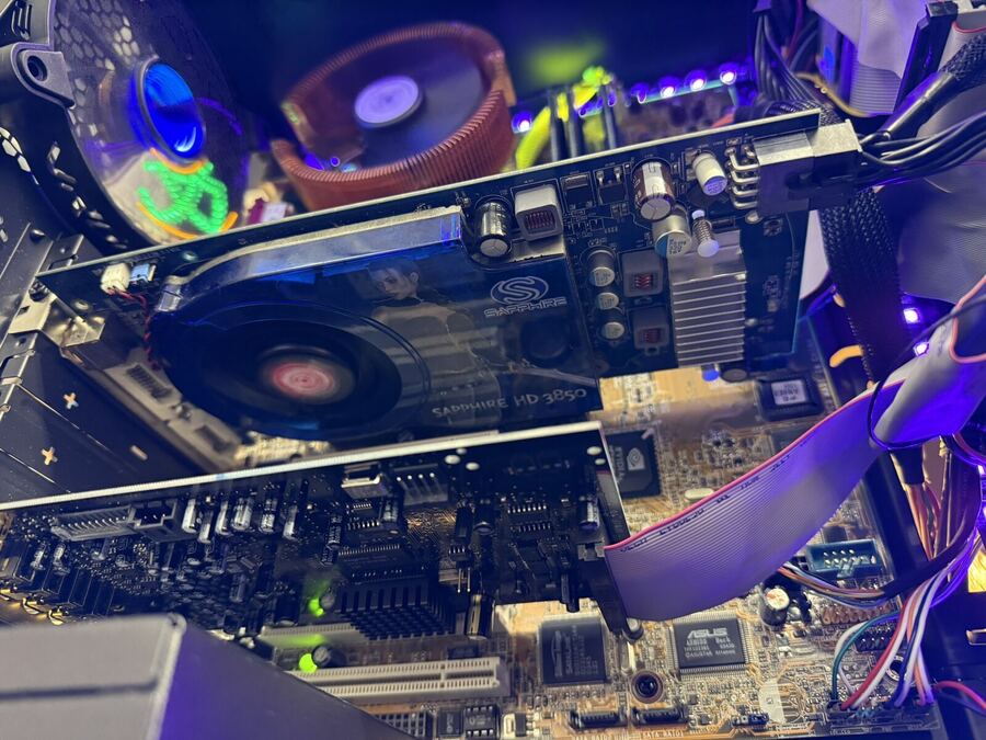 Sapphire Radeon graphics card installed in a build, lit blue