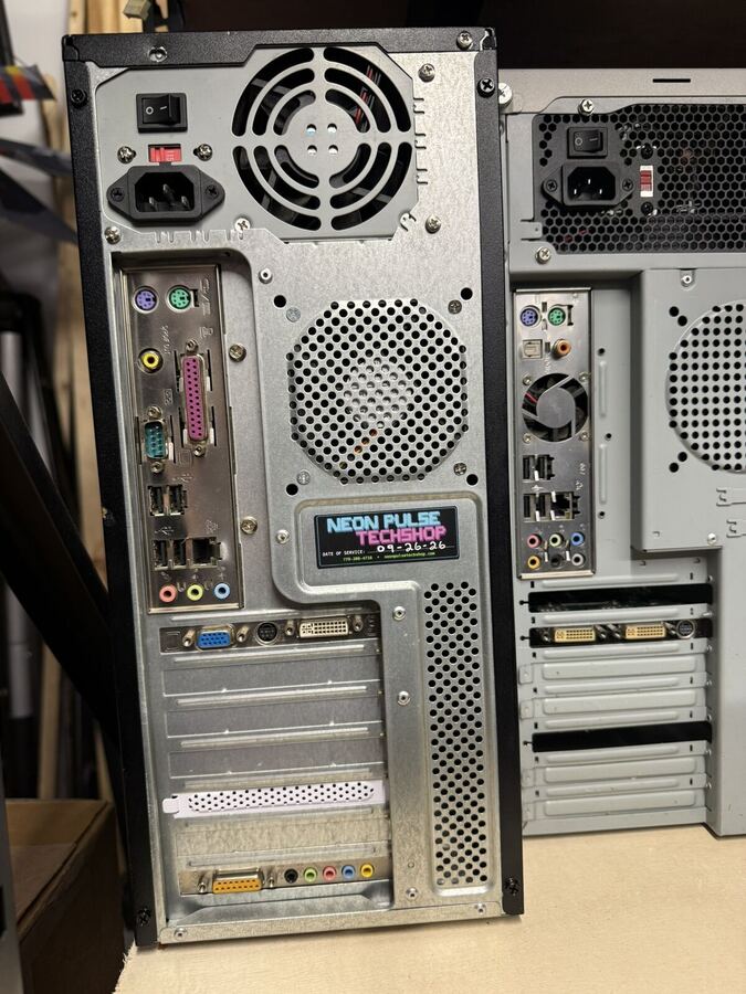 Rear panel of a tower with the NEON PULSE case badge